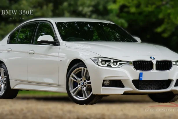 White BMW 330e plug-in hybrid sedan parked outdoors, showcasing sleek design and performance in this BMW 330e review.