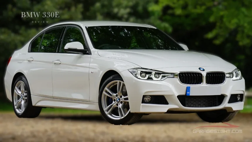White BMW 330e plug-in hybrid sedan parked outdoors, showcasing sleek design and performance in this BMW 330e review.