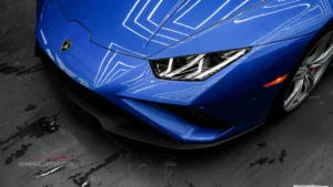 Ceramic coating on a blue Lamborghini, showcasing superior paint protection, hydrophobic properties, deep gloss, and long-lasting shine.